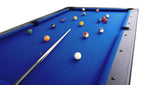 Pool balls and a cue on the blue cloth of the Heemskerk Kick Shot pool table