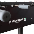 Grey handle and ball return on the side of the Heemskerk King Pro foosball table