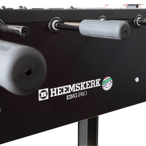 Grey handle and ball return on the side of the Heemskerk King Pro foosball table