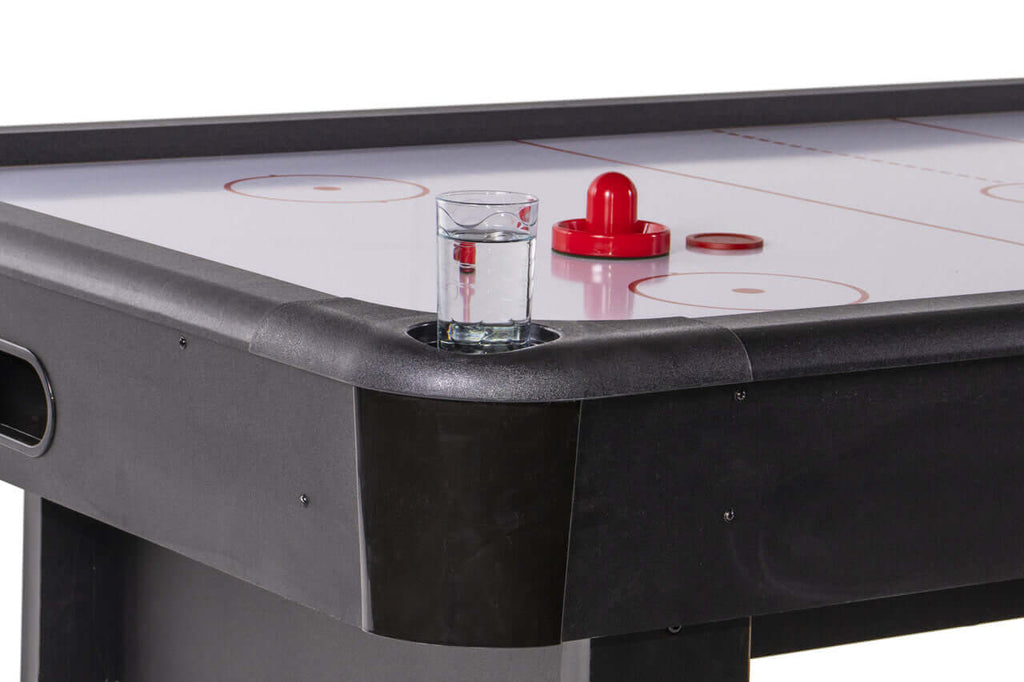 Pusher stored in the corner compartment of the Heemskerk Masterplay air hockey table