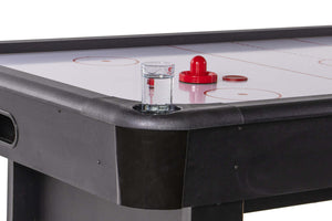 Pusher stored in the corner compartment of the Heemskerk Masterplay air hockey table