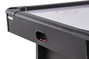 Puck return slot at the end of the Heemskerk Masterplay air hockey table