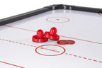 Red pushers and pucks on the white playfield of the Heemskerk Masterplay