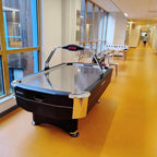 Heemskerk Navona air hockey table in a bright corridor with an orange floor