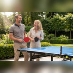 Couple holding bats beside a Heemskerk Novi 2100 outdoor table tennis table in a garden