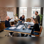 Colleagues holding a meeting around a Heemskerk Office 3000 table tennis table