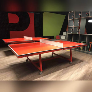 Two orange Heemskerk Office 3500 table tennis meeting tables in a games room