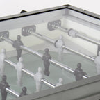 Rods and players under the clear cover of the Heemskerk High TacTic Cover football table