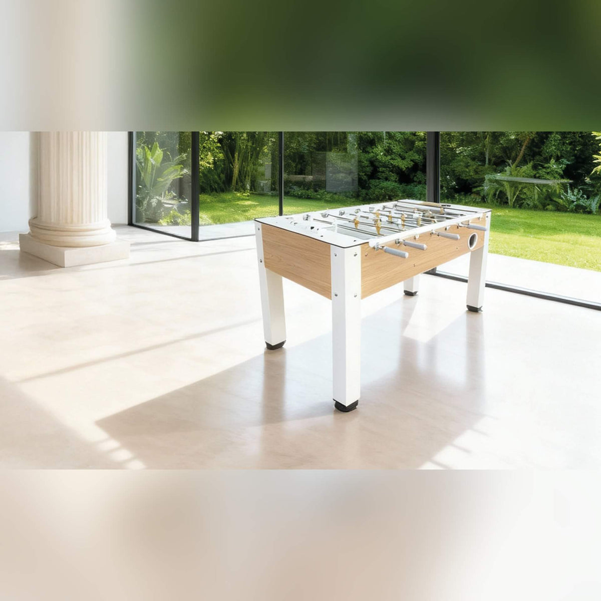 Heemskerk Vittorio football table in a bright room with garden views