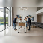 Four friends playing on a Heemskerk Vittorio football table in a modern living room