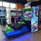 Jet Blaster arcade machine glowing in a family entertainment centre