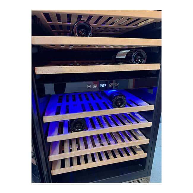Wooden shelves and wine bottles inside a Kaiser Art Deco wine cooler with LED lighting