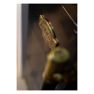 Close-up of the gold Kaiser badge on the Art Deco beer and wine cooler