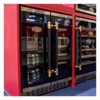 Kaiser Art Deco beer and wine cooler filled with drinks in a showroom with red walls