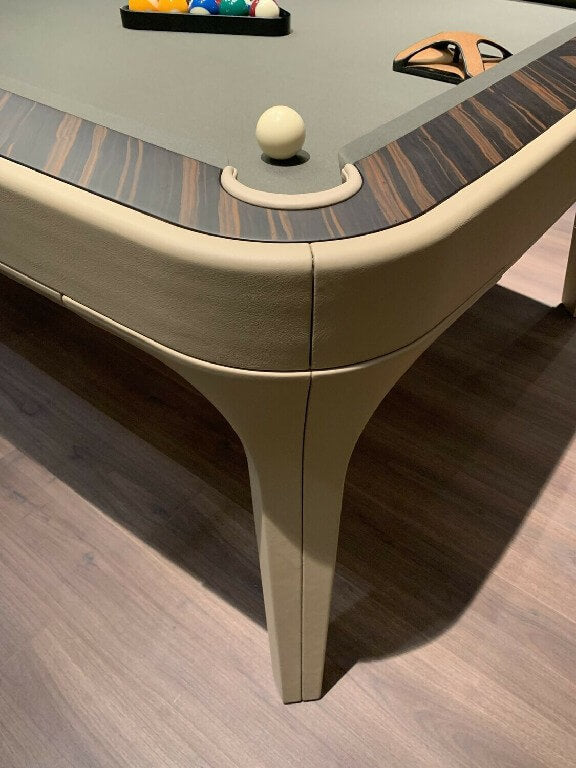 Corner of the Luxury Dandy showing beige leather, ebony makassar rail and pool balls