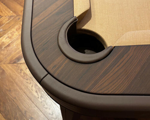 Close-up of a leather-lined pocket and ebony makassar top rail on the Luxury Dandy