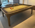 Taupe leather Luxury Dandy with camel cloth and racked balls by a staircase