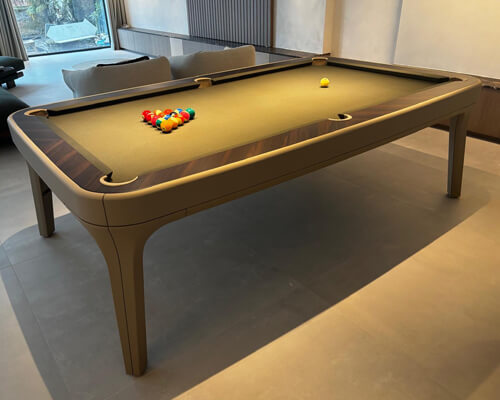 Taupe leather Luxury Dandy with camel cloth and racked balls by a staircase