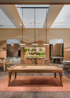 Luxury Dandy pool table on a terracotta rug in a warm-toned room