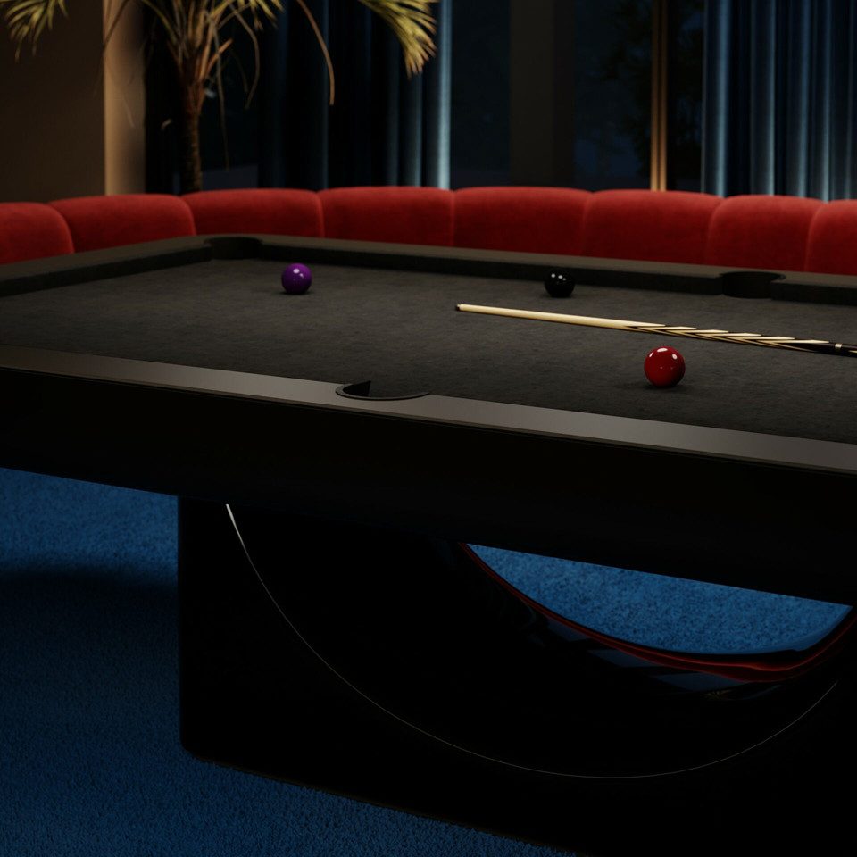 Curved central base of a black Luxury Mono pool table with balls on dark cloth
