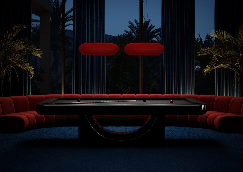Black Luxury Mono pool table in a dark lounge with red seating
