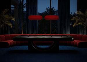 Black Luxury Mono pool table in a dark lounge with red seating