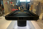 End view of the black Luxury Mono pool table with crossed cues