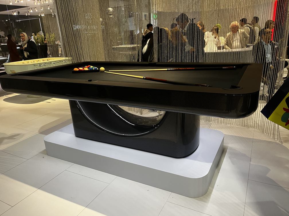 Luxury Mono pool table in a black carbon-fibre-effect finish with a sculptural central base