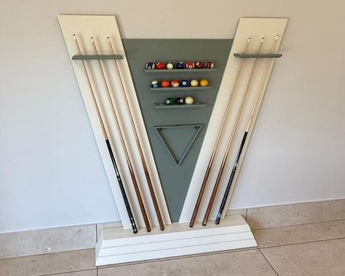 Matching Newde cue rack in white and sage grey lacquer with cues and balls