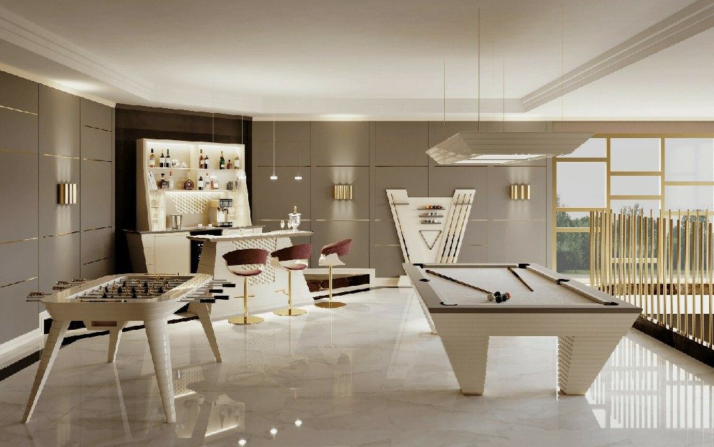 Cream Luxury Newde pool table in an open-plan games room with a bar