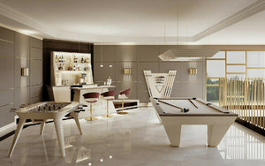 Cream Luxury Newde pool table in an open-plan games room with a bar