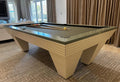 Luxury Newde pool table with ivory ribbed tilted legs, sage grey top rail and dark cloth in a living room