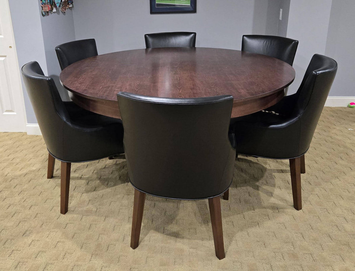 Luxury round poker table with the wooden dining cover fitted, set with black leather chairs