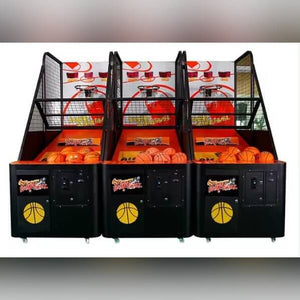 Three basketball arcade machines side by side