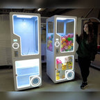 Capsule vending kiosk in use in a shop