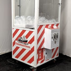 Red and white striped cooled claw machine