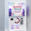 Counter-top gashapon machine with a lightbox poster and a clear capsule window