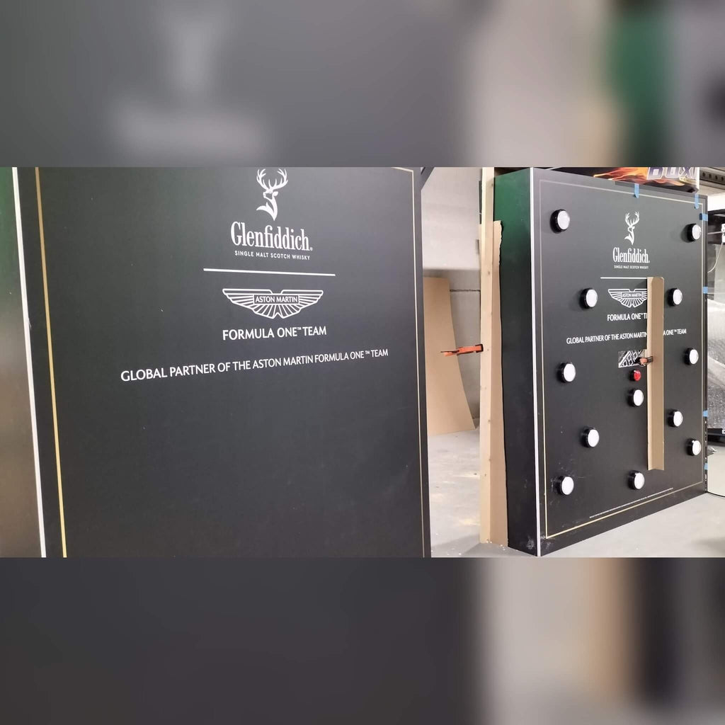 Side view of a custom MadeForArcade batak reflex wall branded for Glenfiddich and the Aston Martin Formula One team