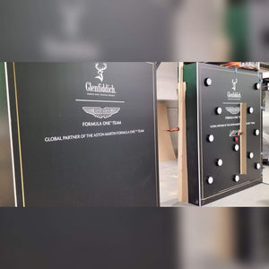 Side view of a custom MadeForArcade batak reflex wall branded for Glenfiddich and the Aston Martin Formula One team