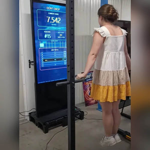 A girl stepping up to the dead hang challenge