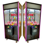 Pair of DIY claw machines filled with prizes