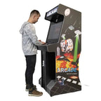 A man playing the full-size arcade machine