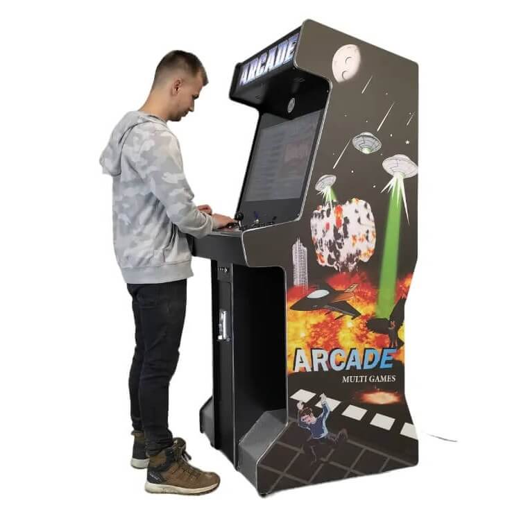 A man playing the full-size arcade machine