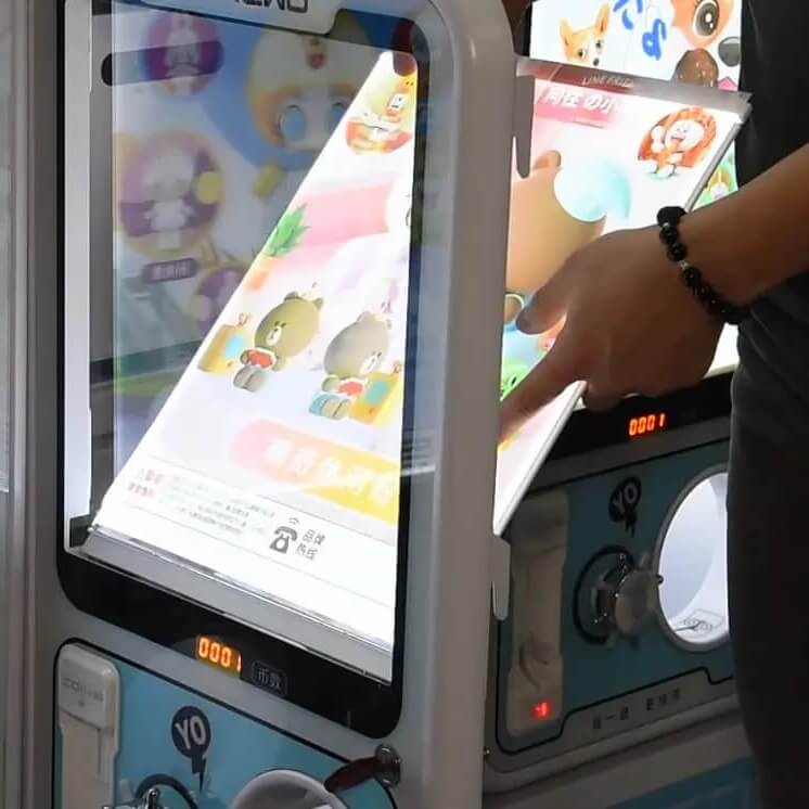 GashaGold gashapon machine with a poster lightbox