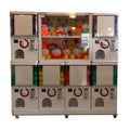 MadeForArcade GashaPro gashapon wall with six capsule machines and a two-storey display window