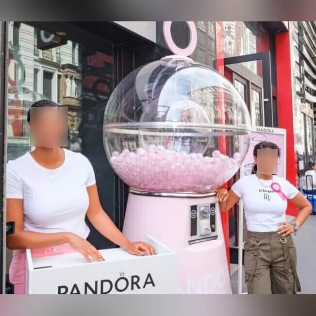 Children with the giant gumball machine at a branded event