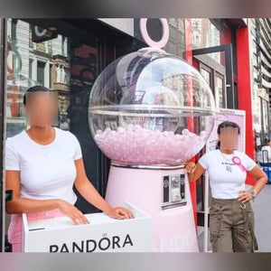 Children with the giant gumball machine at a branded event