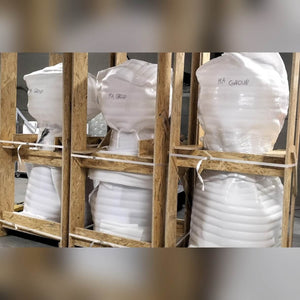 Giant gumball machines packed in crates ready for delivery