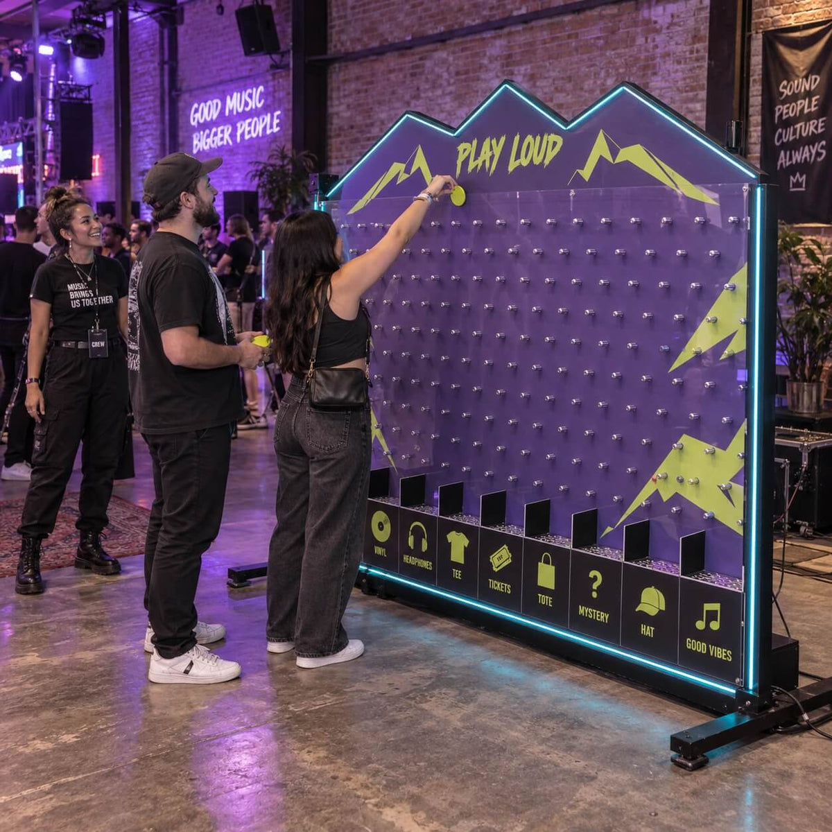Lit Plinko board at an evening event