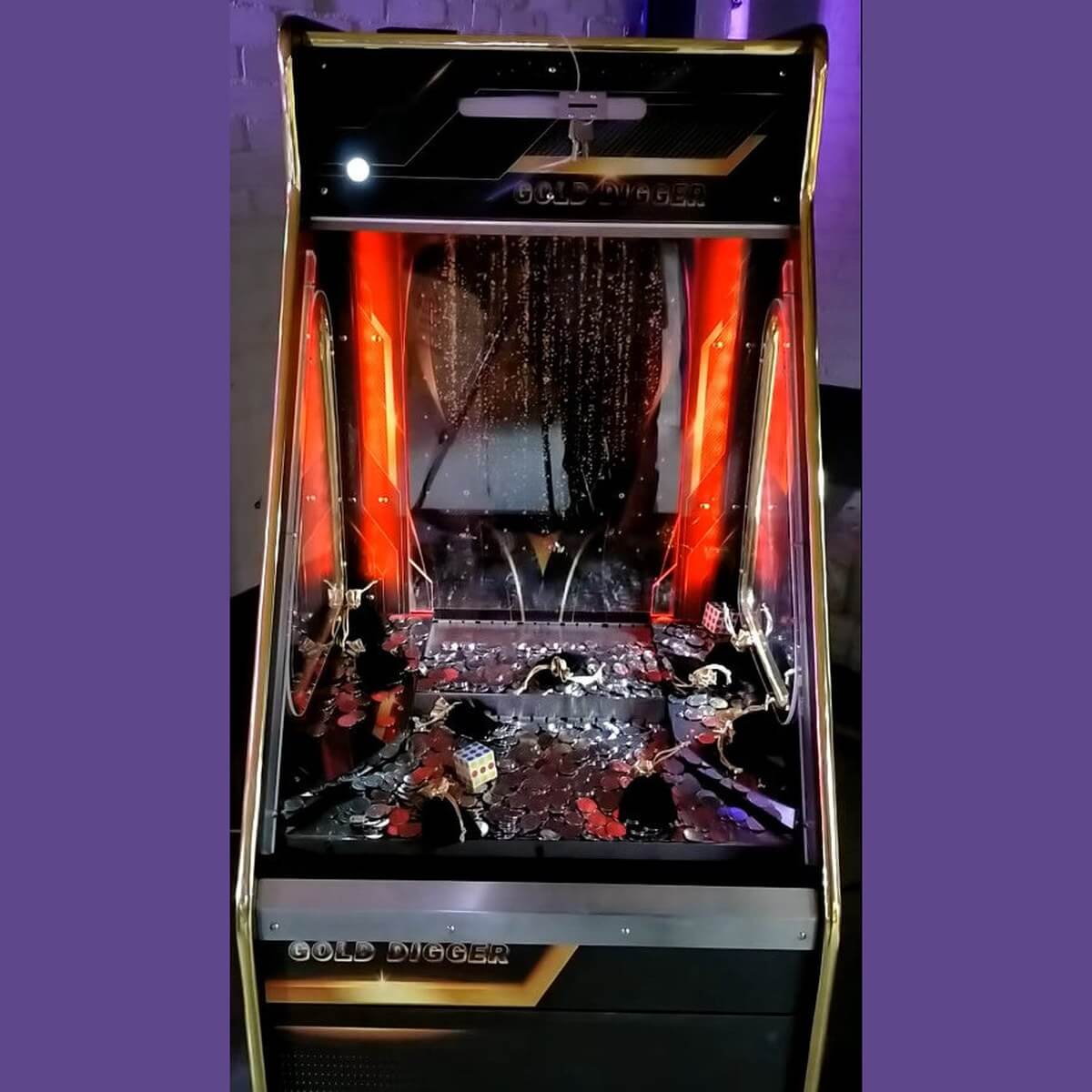 Gold Digger coin pusher lit up with red lights